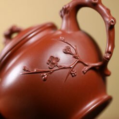 Ấm tử sa báo xuân quai ấm giống cành mai